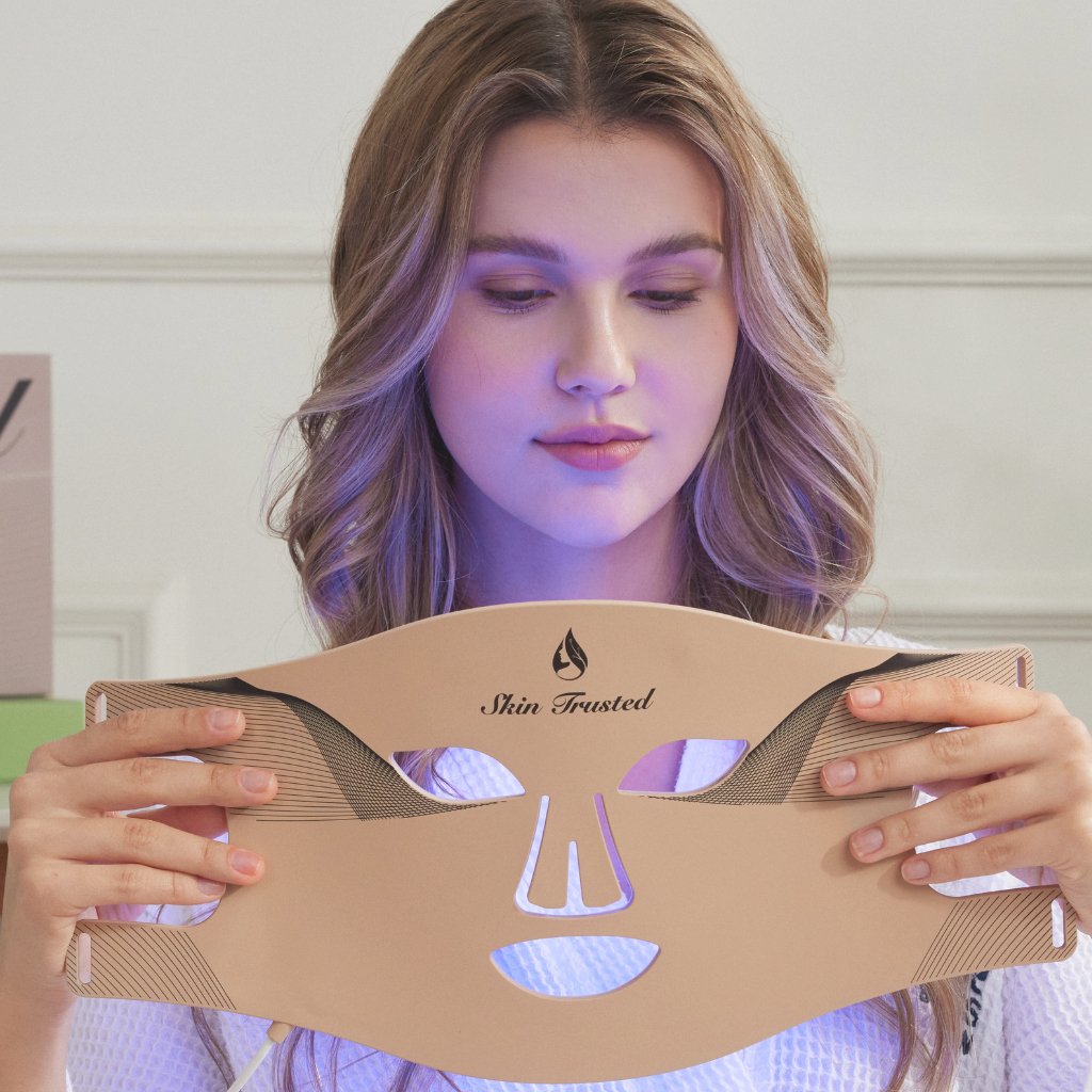 Model-using-blue-light-therapy-mask-front-view